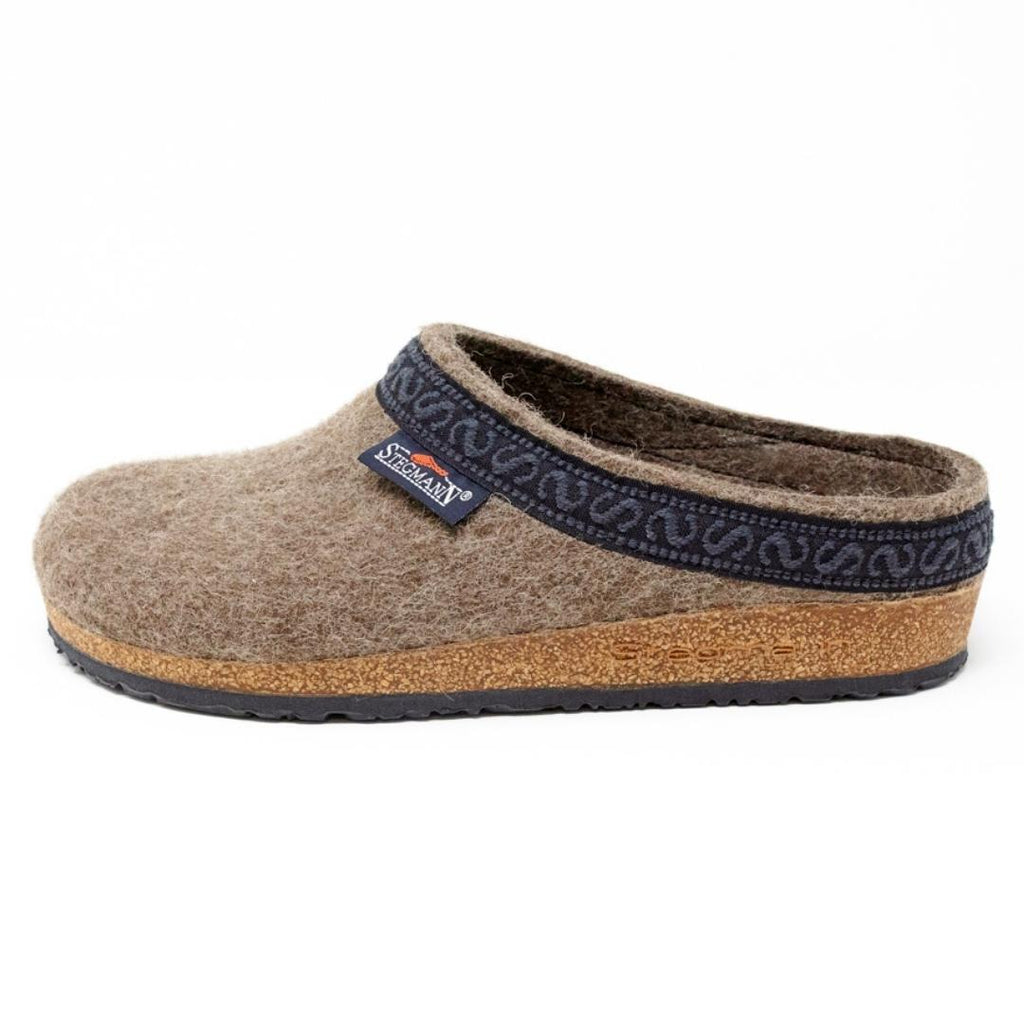 The Women's Original 108 Wool Clog - Medium, crafted from Merino wool felt with a cork and latex sole and adorned with a dark blue trim, is displayed on a white background.