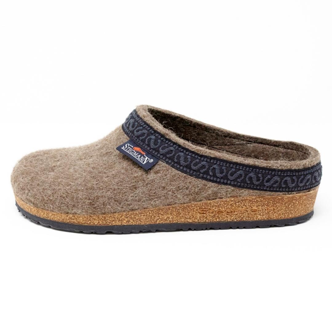 The Women's Original 108 Wool Clog - Medium, crafted from Merino wool felt with a cork and latex sole and adorned with a dark blue trim, is displayed on a white background.