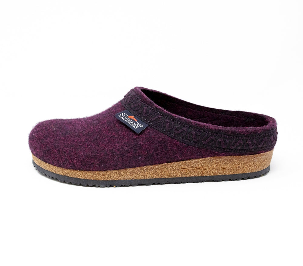 A Women's Original 108 Wool Clog in dark burgundy, made of luxurious Merino wool felt with a stylish black trim, and designed with a comfortable cork & latex sole.