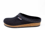The Women's Original 108 Wool Clog - Medium is a black slip-on crafted from Merino wool felt, featuring a cork & latex sole and decorative trim for the perfect blend of comfort and style in a women's shoe.