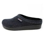 The Men's WoolFlex Wool Clog is a dark blue felt slipper crafted from Merino wool, featuring a black sole, subtle trim around the opening, and a branded side tag. The built-in arch support combines style with comfort.