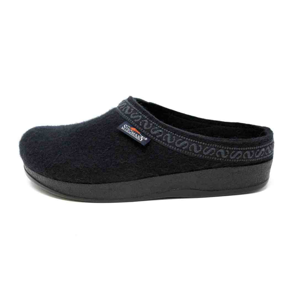 Men's WoolFlex Wool Clog in black, slip-on Merino wool design with embroidered trim and thick supportive sole with arch support, displayed side view on a plain white background.