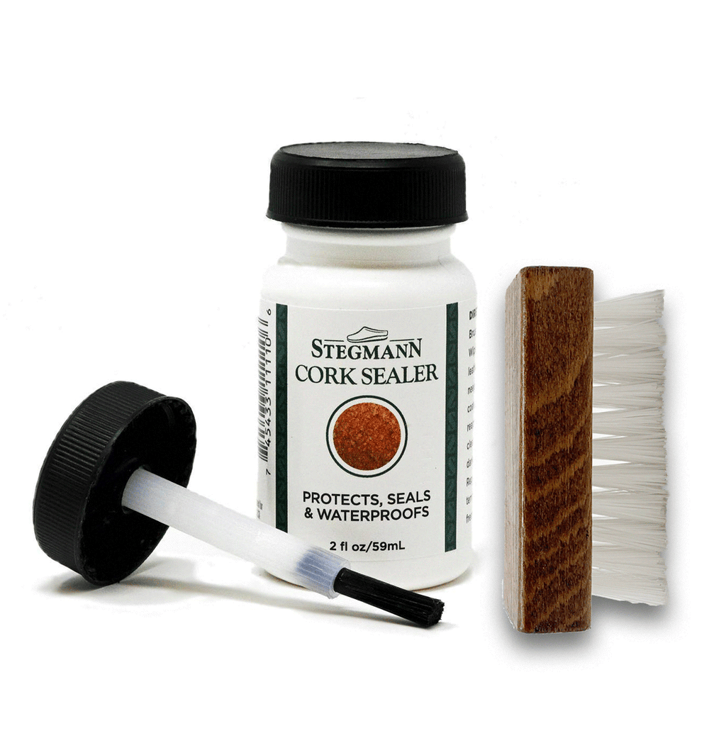 The Wool & Cork Care Kit - Brush & Sealer includes a bottle of Stegmann Cork Sealer with brush applicator and a small wooden cleaning brush with white bristles, ideal for maintaining your Stegmann clogs.