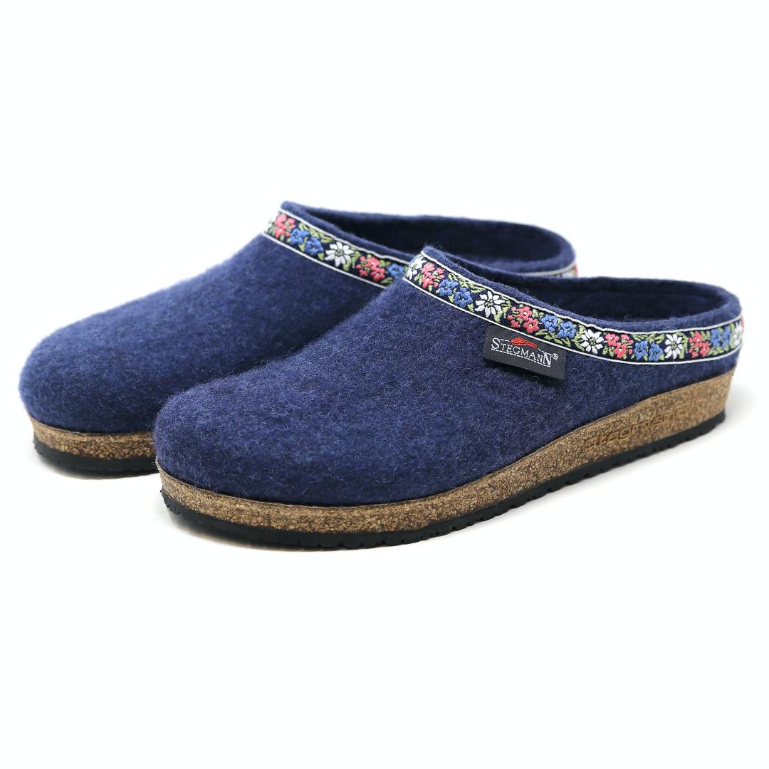 The Women's Edelweiss Wool Clog - Medium features blue felt with an elegant embroidered band and comfortable cork soles.