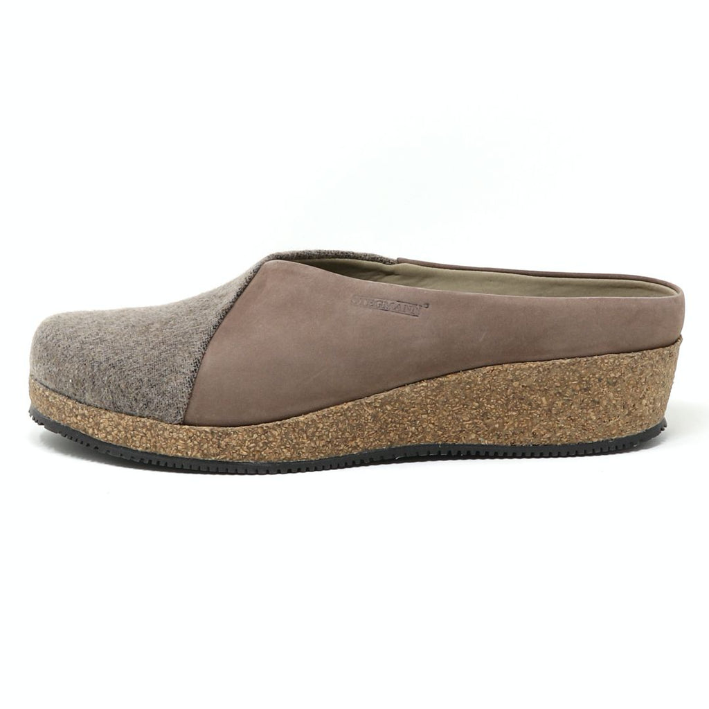 The Elsa Stretch Felt & Nubuck Wedge Mule in a side view features slip-on design with grey fabric upper, brown leather sides, and thick cork sole. It includes a subtle stretch felt panel for comfort and style.