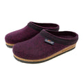 The Women's Original 108 Wool Clog in purple, constructed from Merino wool felt, showcases a sophisticated black trim and a cozy cork and latex sole.