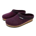 The Women's Original 108 Wool Clog in purple, constructed from Merino wool felt, showcases a sophisticated black trim and a cozy cork and latex sole.