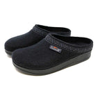 A black slip-on slipper labeled "Stegmann," with a patterned trim and an anatomically contoured sole for cushion comfort, known as the Women's WoolFlex Wool Clog - Medium.
