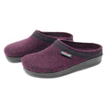 The Women's WoolFlex Wool Clog - Wide is a pair of purple Merino wool felt clogs, adorned with black trim and soles, and includes a brand tag on one shoe. These stylish clogs offer excellent arch support and all-day comfort.