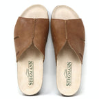 Women's Layna Leather Wedge Sandal is a brown leather slip-on featuring a sustainable cork midsole and "Stegmann" printed on the beige insoles.