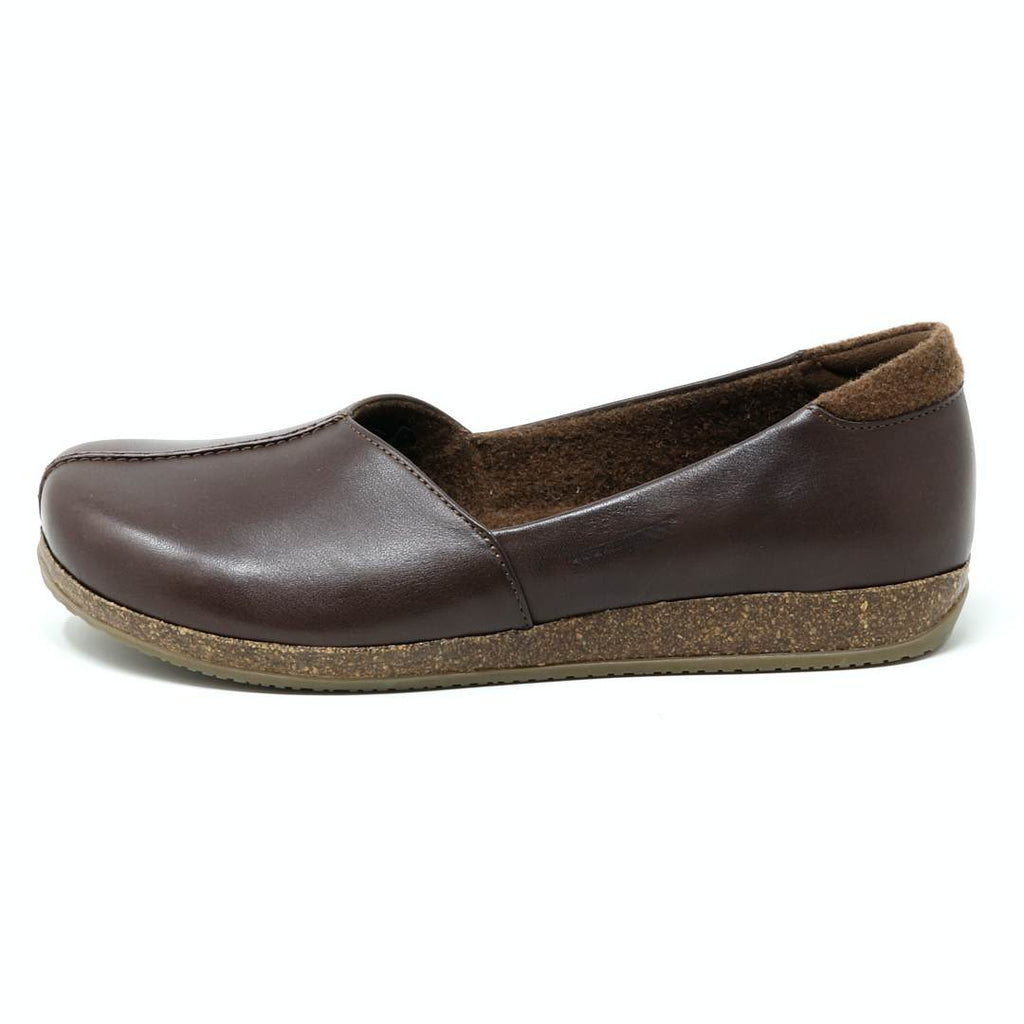 Women's Liesl Leather Skimmer, a brown leather slip-on featuring a leather upper and flat cork sole, displayed in a side profile on a white background.