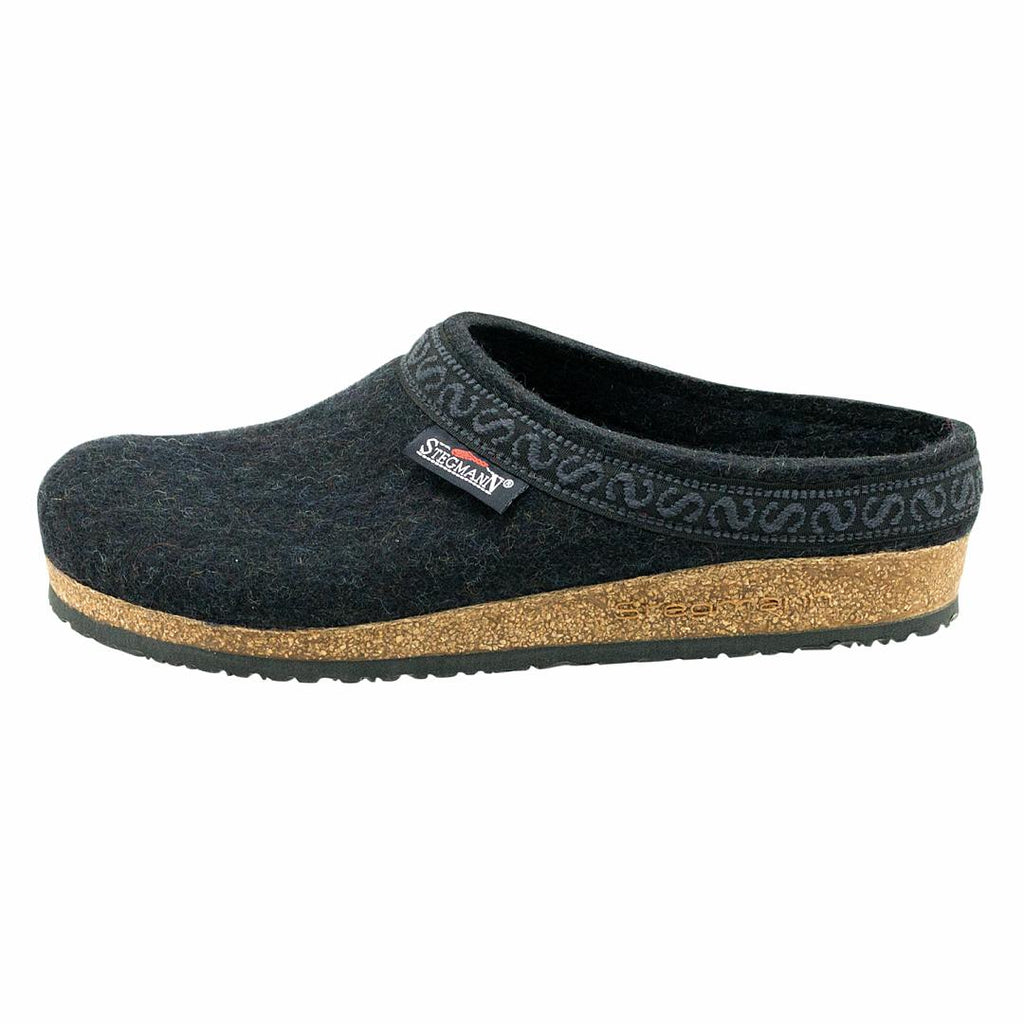 Introducing the Men's Original 108 Wool Clog—a black felt slipper featuring a cork support sole and a patterned trim, blending style and comfort perfectly for men.