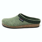 The Women's Original 108 Wool Clog - Medium is crafted from luxurious Merino wool felt and features a cork and latex sole for enhanced comfort and durability. It includes black trim, a decorative pattern, and a logo tag on the side.