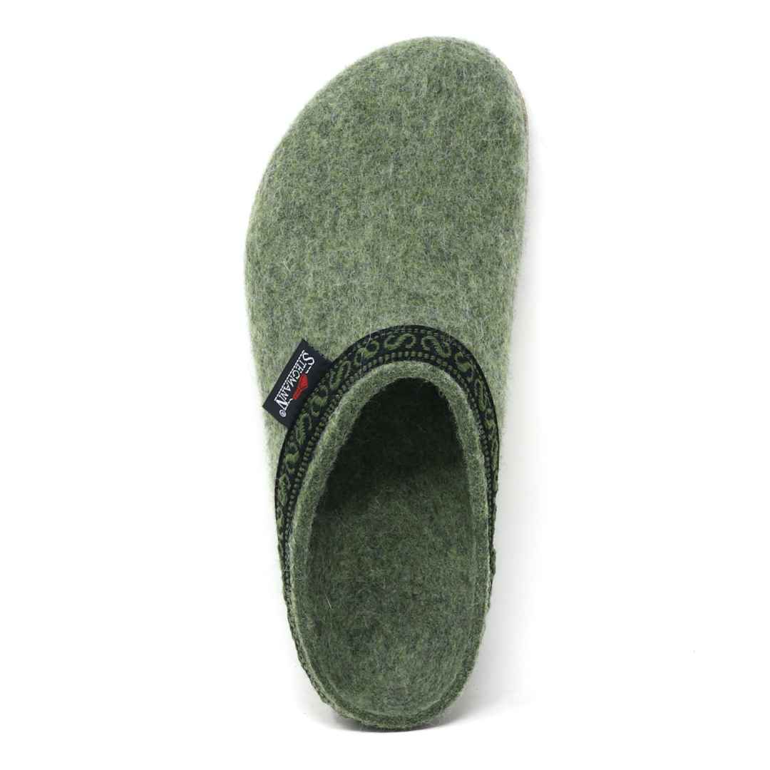 The Women's Original 108 Wool Clog - Medium is a single green slipper made from Merino wool felt, highlighted with a black patterned trim and viewed from above. It elegantly features a cork and latex sole.