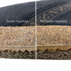 The shoe sole is shown half-treated with Stegmann Cork Sealer, highlighting a darker, glossy finish, while the untreated half exhibits a lighter, matte texture.