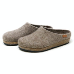 The Women's Eco Wool Clog features gray wool slippers with cork latex footbeds and a small leather tag, crafted from sustainable wool.
